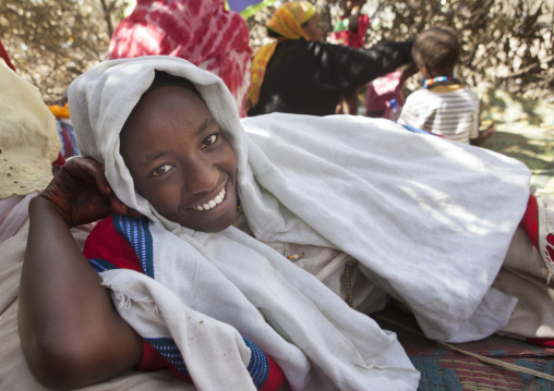 Smiling Karrayyu Tribe Woman Resting In The House Built For The Gadaaa Ceremony During Gadaaa Ceremony, Metahara, Ethiopia