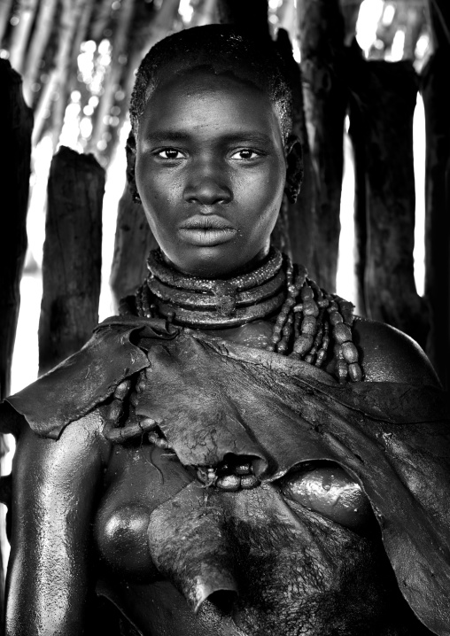 Utah Woman From The Hamer Tribe Posing In Her Hut, Omo Valley, Ethiopia