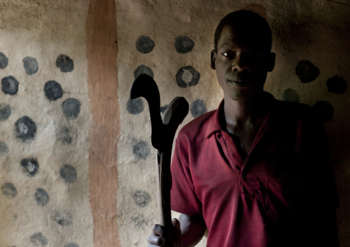 Ari man with scythe in hand omo valley Ethiopia