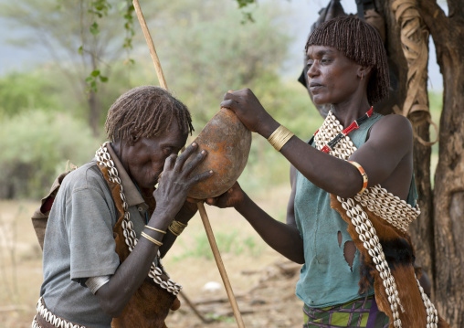 Bana Man Drinking Alcoholic Beverage From Half Calabash Given By Banna Woman Ethiopia