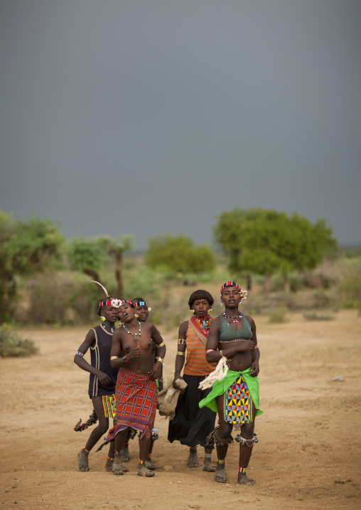 Group Of Bana Women In Traditional Clothing Walk Ethiopia