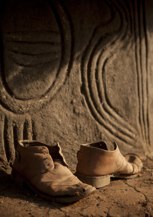 Old Shoes In Front Of An Anuak Traditional Hut In Abobo, The Former Anuak King Village, Gambela Region, Ethiopia