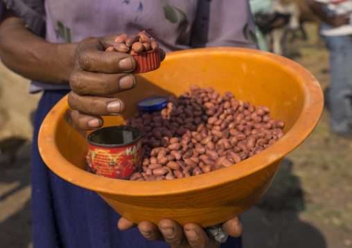 Child Selling Peanuts In The Street, Gambela, Ethiopia