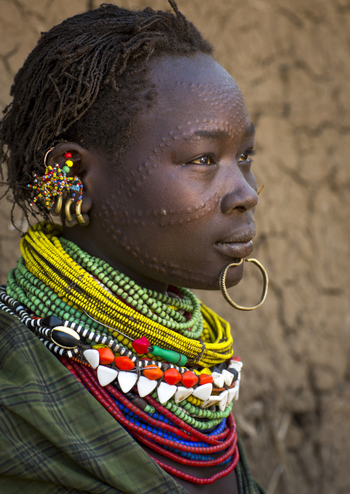 Portrait Of A Topossa Woman, With Traditional Clothes, Omo Valley, Kangate, Ethiopia