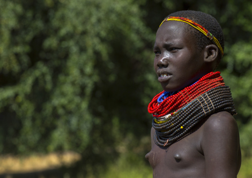 Portrait Of A Nyangatom Tribe Girl With Huge And Colourful Necklaces, Omo Valley, Kangate, Ethiopia