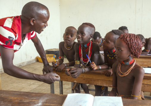 Hamer Tribe Kids With The Teacher In A School, Turmi, Omo Valley, Ethiopia