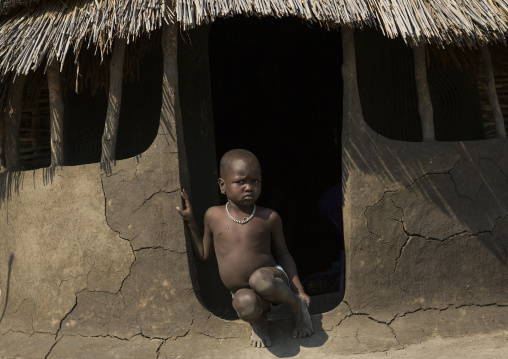 Nuer Tribe Little Boy At The Entrance Of His Hut, Gambela, Ethiopia