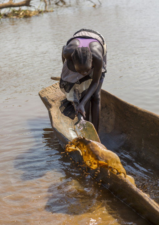 Anuak Tribe Woman Inside A Pirogue On Baro River, Gambela, Ethiopia