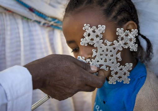 Ethiopian Orthodox Priest Blessing The Pilgrims With A Cross During The Timkat Epiphany Festival, Lalibela, Ethiopia