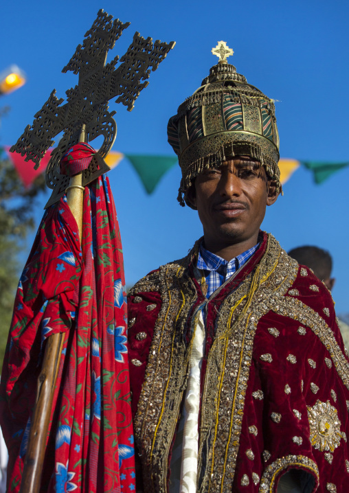 Ethiopian Orthodox Priest Holding A Cross During The Colorful Timkat Epiphany Festival, Lalibela, Ethiopia