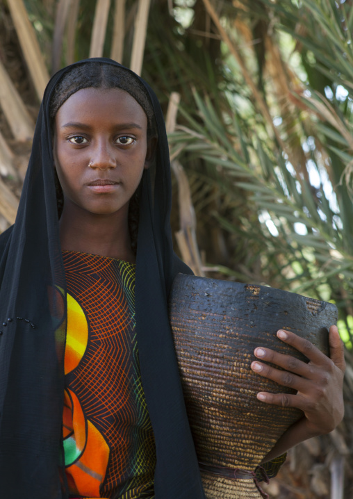 Fatouma Mahammed From Afar Tribe Holding A Pot Of Camel Milk, Afambo, Ethiopia