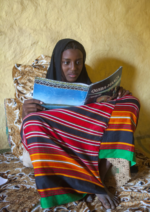 Fatouma Mahammed From Afar Tribe Reading A School Book, Afambo, Ethiopia