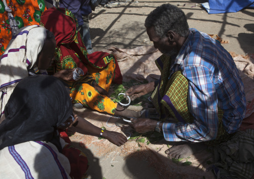 Karrayyu Blacksmith Putting A New Ankle On A Girl For Her Wedding, Metahara, Ethiopia