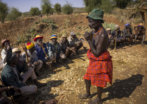 Men Negociating During A Mourning Ceremony To Know How Many Cows Will Be Killed In Hamer Tribe, Turmi, Omo Valley, Ethiopia