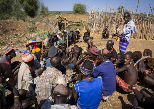 Men Negociating During A Mourning Ceremony To Know How Many Cows Will Be Killed In Hamer Tribe, Turmi, Omo Valley, Ethiopia