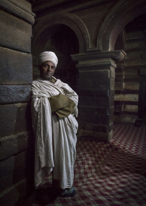 Priest Inside Yemrehana Krestos Rock Church, Lalibela, Ethiopia