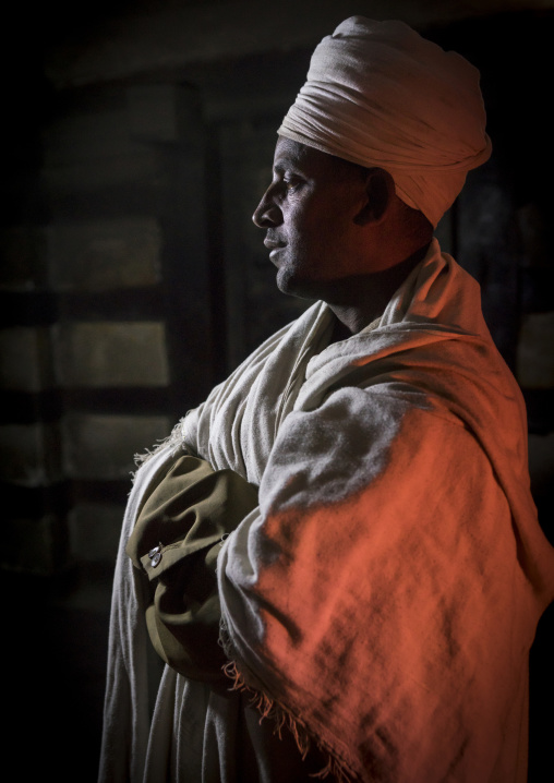 Priest Inside Yemrehana Krestos Rock Church, Lalibela, Ethiopia