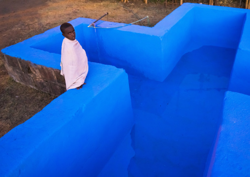 Orthodox Pilgrim In Front Of The Pool At Timkat Festival, Lalibela, Ethiopia