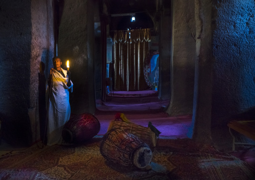 Priest Holding A Candle Inside A Rock Church, Lalibela, Ethiopia