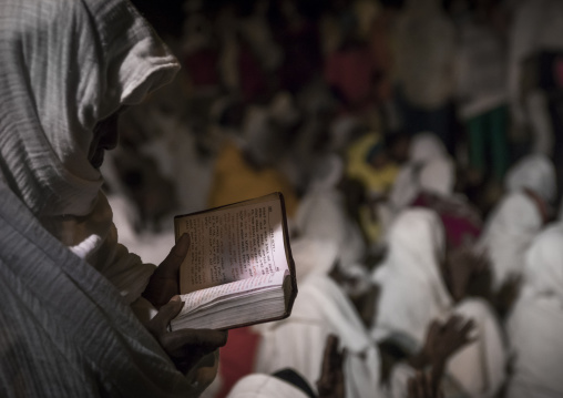 Orthodox Pilgrim Reading The Bible At Timkat Festival, Lalibela, Ethiopia