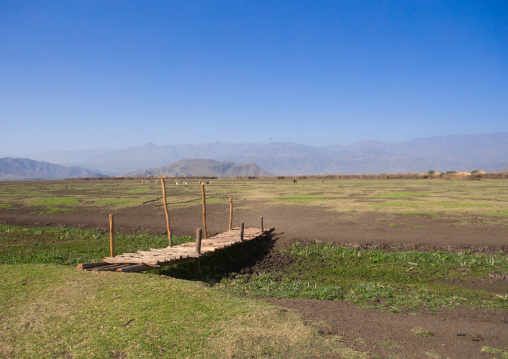 Bridge over a dry river in front of an oromo village, Amhara region, Artuma, Ethiopia