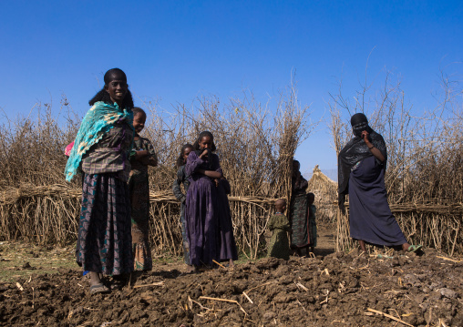 Oromo family in front of their hut, Amhara region, Artuma, Ethiopia