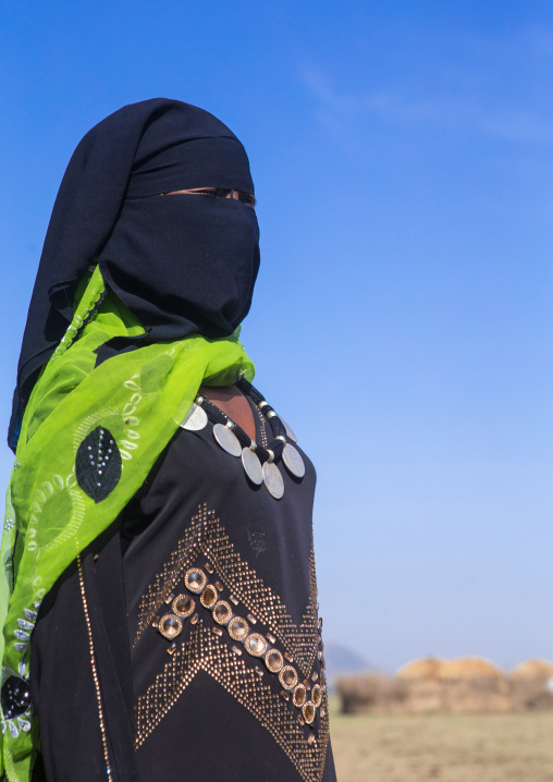 Portrait of an oromo woman with maria theresa thalers necklace, Amhara region, Artuma, Ethiopia