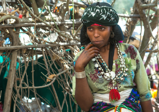 Oromo woman with silver maria theresa thalers necklace, Oromo, Sambate, Ethiopia