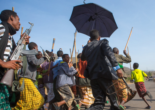 Oromo groom with an umbrella during his wedding celebration, Oromo, Sambate, Ethiopia