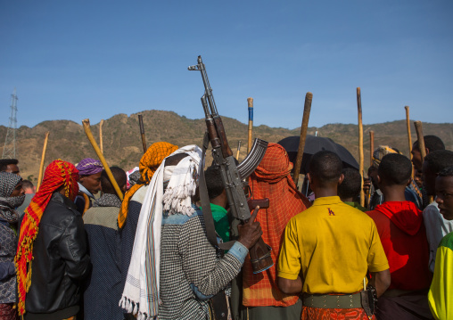 Oromo men with kalashnikovs during a wedding celebration, Oromo, Sambate, Ethiopia