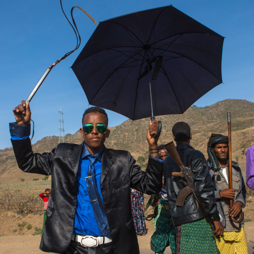 Oromo groom with a whip during his wedding celebration, Oromo, Sambate, Ethiopia