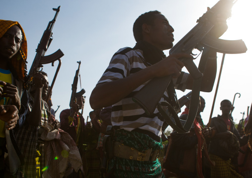 Oromo men with kalashnikovs during a wedding celebration, Oromo, Sambate, Ethiopia