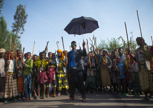 Oromo groom with an umbrella during his wedding celebration, Oromo, Sambate, Ethiopia