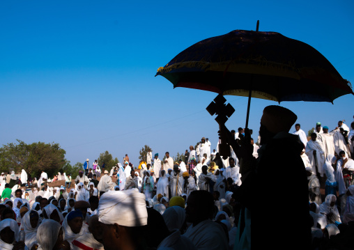 Silhouette of an ethiopian priest blessing the crowd during kidane mehret celebration, Amhara region, Lalibela, Ethiopia