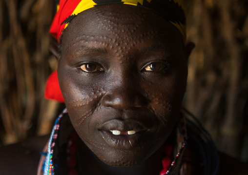 Toposa tribe woman with scarified face, Omo valley, Kangate, Ethiopia