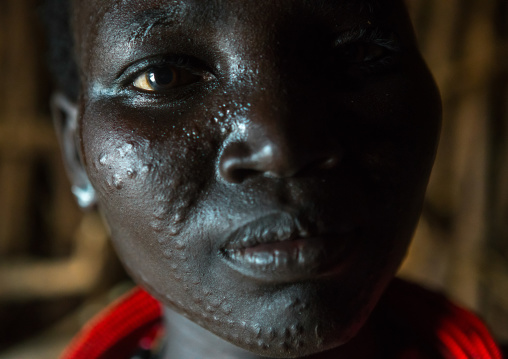 Toposa tribe woman with scarified face, Omo valley, Kangate, Ethiopia