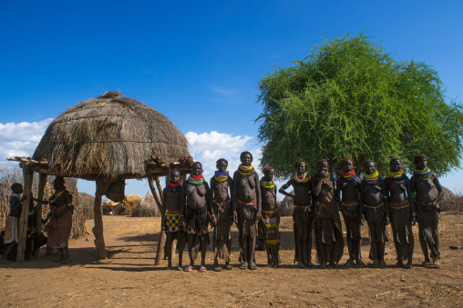 Nyangatom tribe women in a line, Omo valley, Kangate, Ethiopia