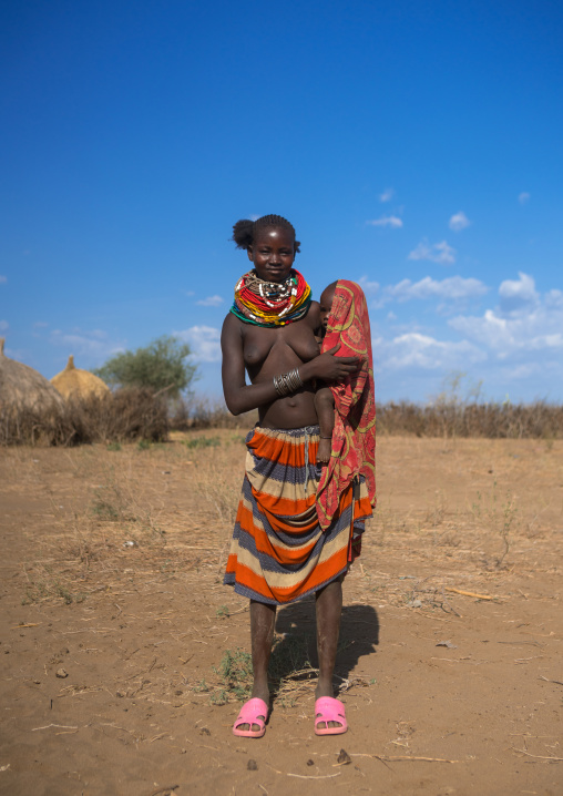 Murle tribe woman with her baby, Omo valley, Kangate, Ethiopia