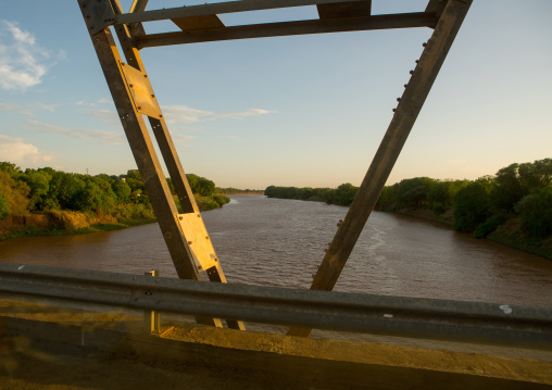 Metal bridge being built by chinese workers above omo river, Omo valley, Omorate, Ethiopia