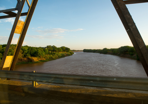 Metal bridge being built by chinese workers above omo river, Omo valley, Omorate, Ethiopia