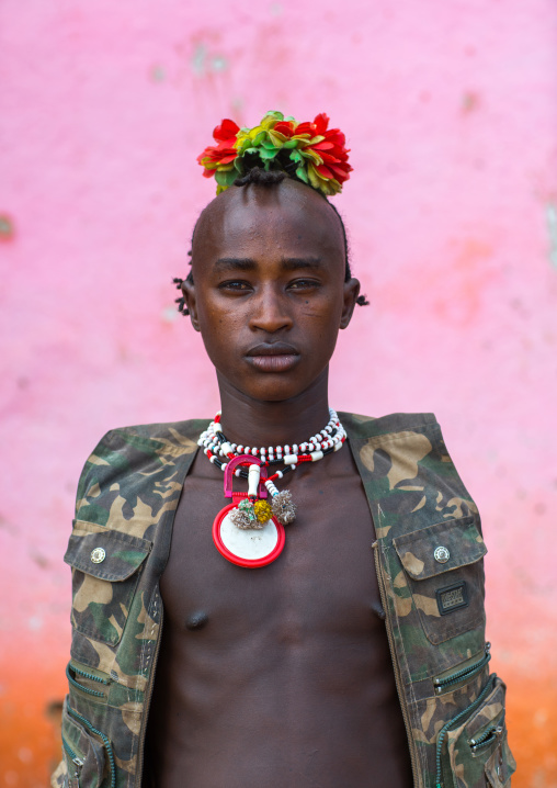 Portrait of a bana tribe man with plastic flowers in the hair, Omo valley, Key afer, Ethiopia