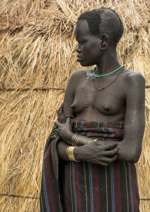 Mursi tribe woman with breast scarifications, Omo valley, Mago park, Ethiopia