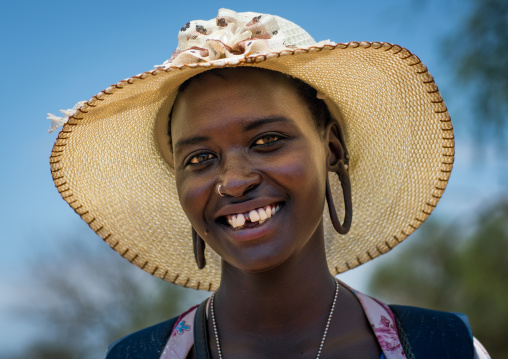 Young mursi tribe woman dressed in western clothes to go in town, Omo valley, Hana mursi, Ethiopia