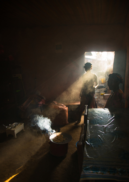 Ray of light in a house during a coffee ceremony, Omo valley, Jinka, Ethiopia