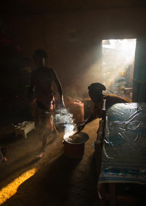 Ray of light in a house during a coffee ceremony, Omo valley, Jinka, Ethiopia