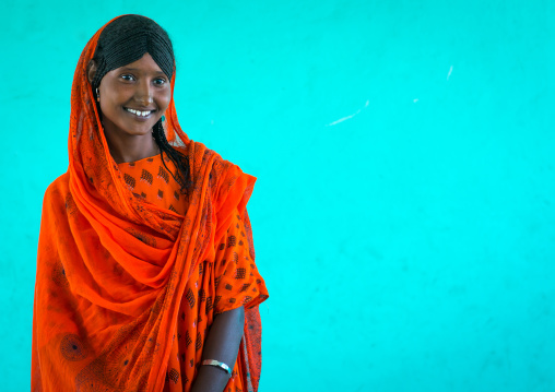 Portrait of an afar tribe girl with braided hair and sharpened teeth, Afar region, Semera, Ethiopia