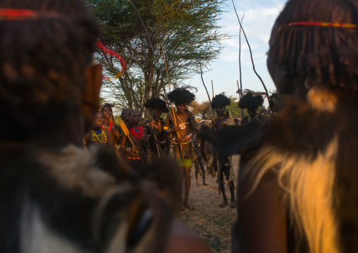 Dassanech men and women during dimi ceremony to celebrate circumcision of teenagers, Omo valley, Omorate, Ethiopia