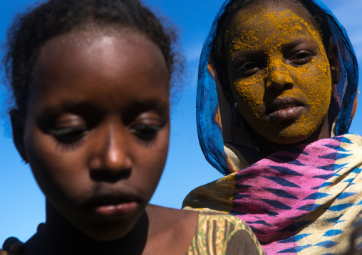 Afar tribe teenage girl with qasil on her face, Afar region, Afambo, Ethiopia