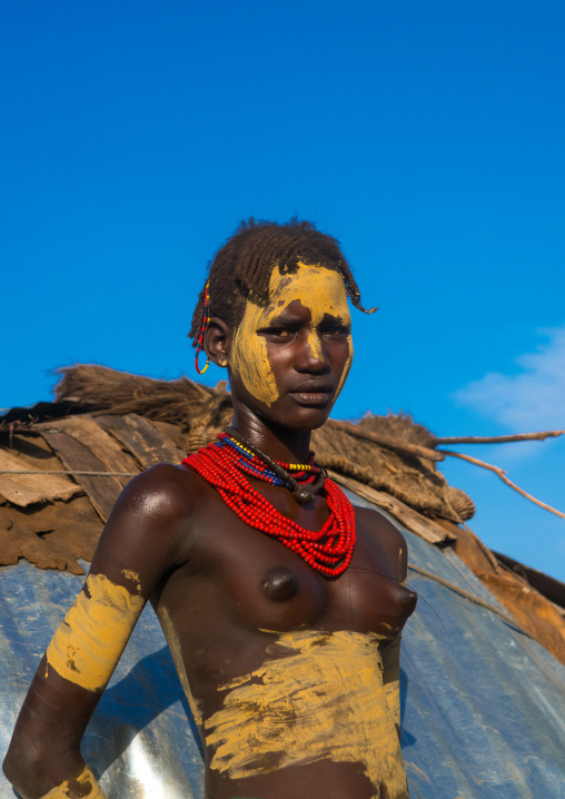 Dassanech tribe teenage girl during dimi ceremony to celebrate circumcision of teenagers, Omo valley, Omorate, Ethiopia