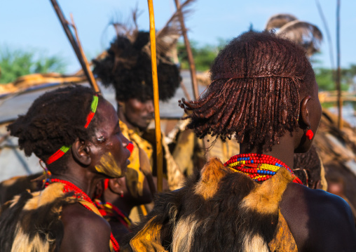 Dassanech men and women during dimi ceremony to celebrate circumcision of teenagers, Omo valley, Omorate, Ethiopia